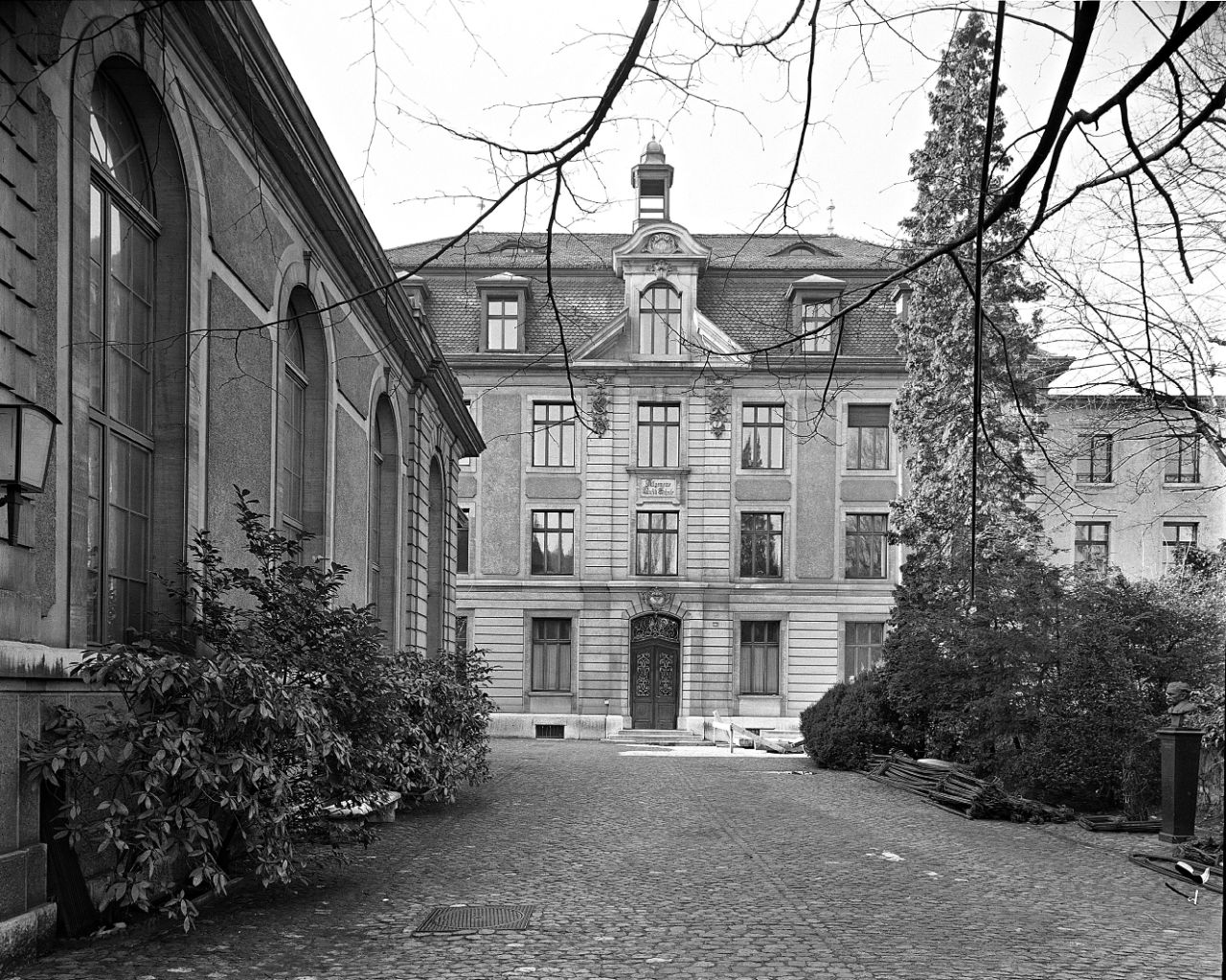 Black and white photograph of the inner courtyard with Great Hall and main building of the Music Academy Basel